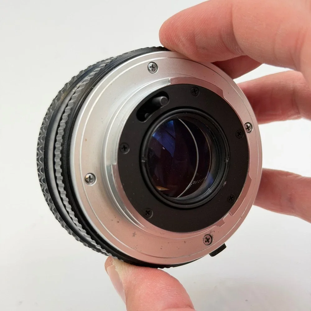 Minolta MC Rokkor-PF 50mm f/2 Lens with 55mm Skylight 1A Hood SR Mount 1126884